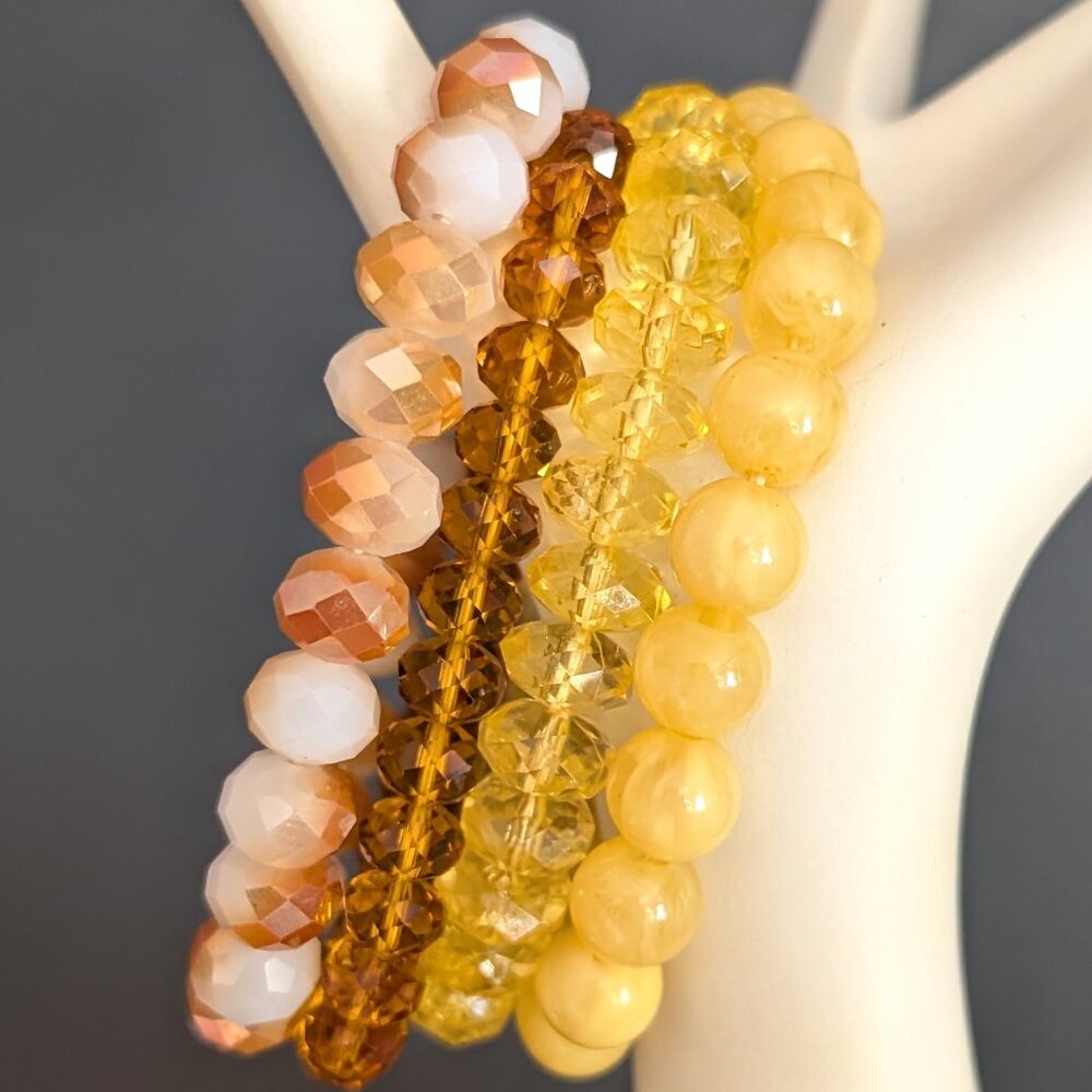Bundle of orange and yellow stretch bracelets